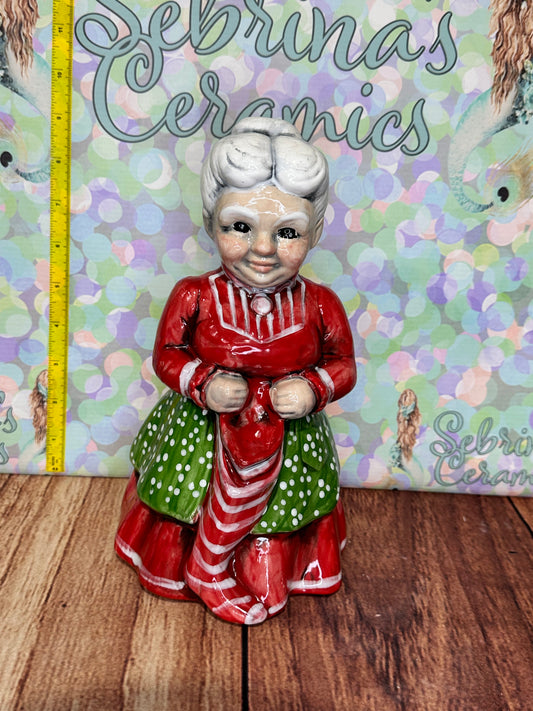 Mrs Clause Holding Stocking