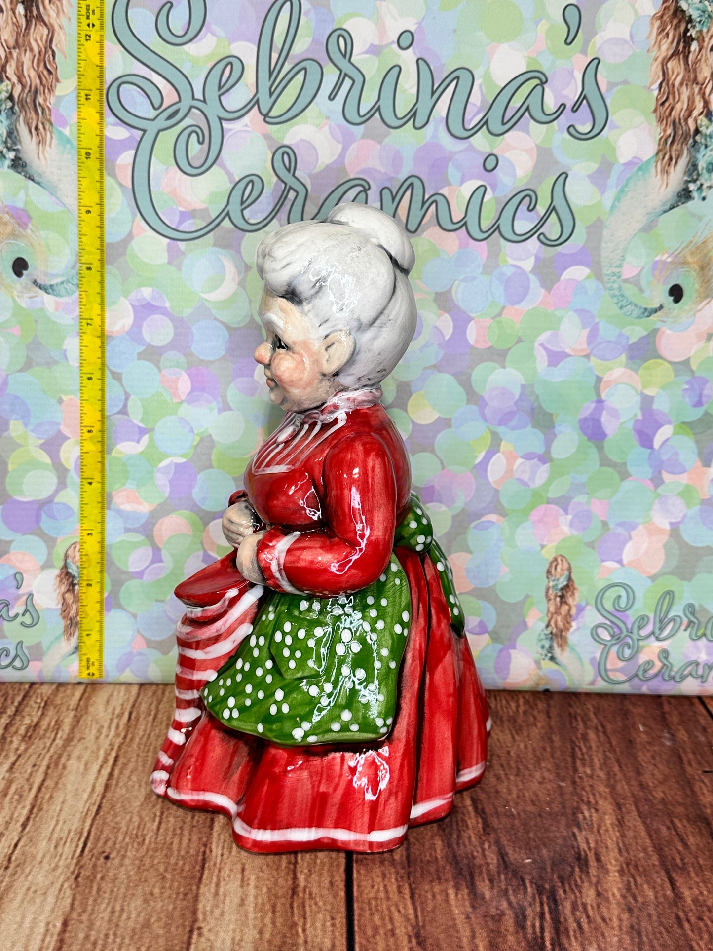 Mrs Clause Holding Stocking