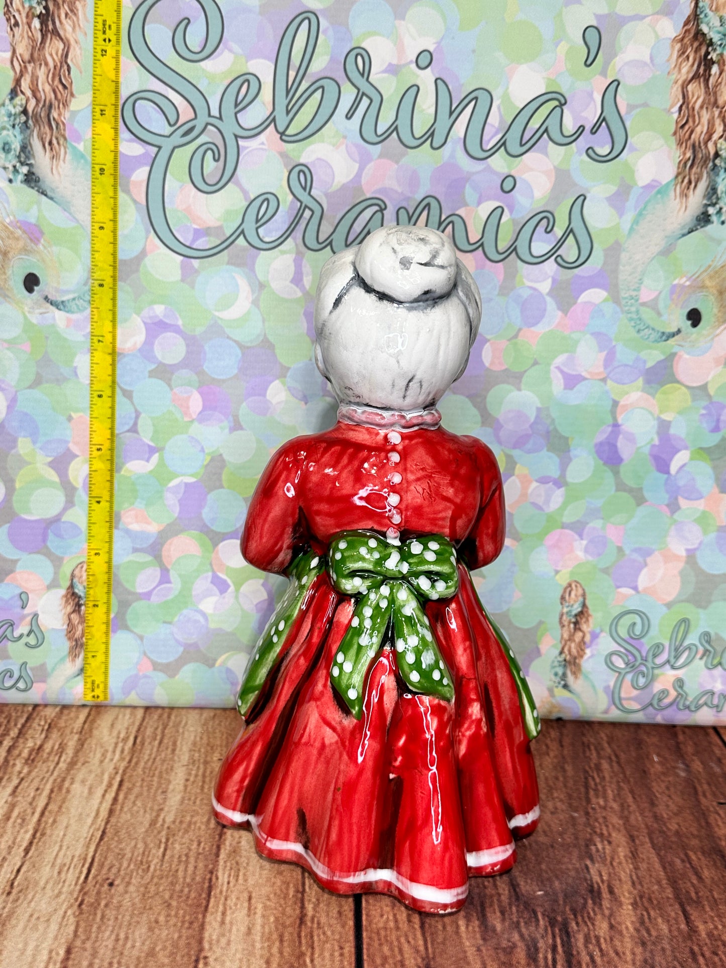 Mrs Clause Holding Stocking