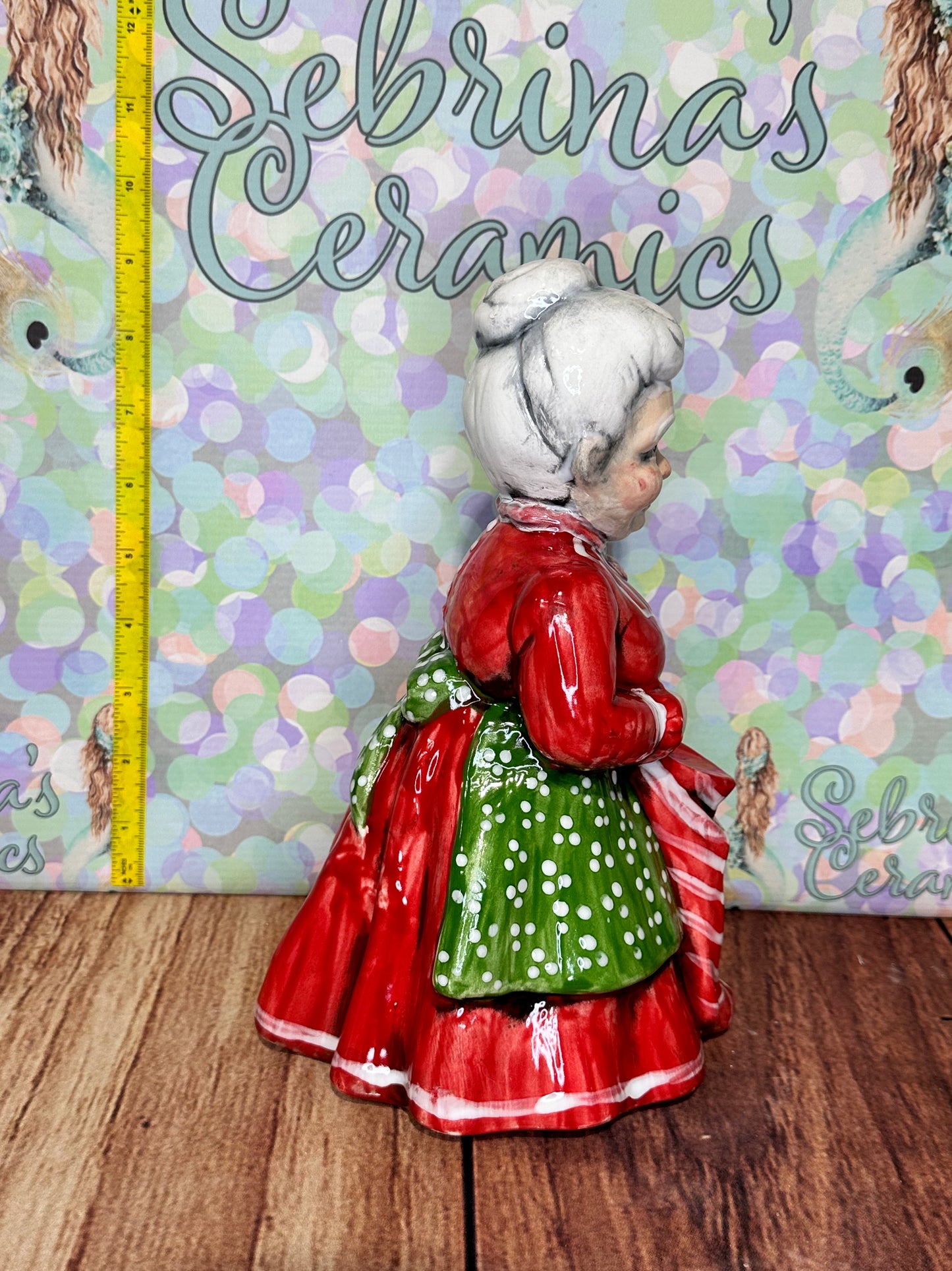 Mrs Clause Holding Stocking